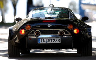 Black sports car road tiltshift - back view free wallpaper