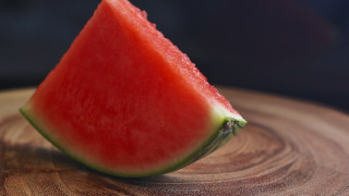 Watermelon slice wooden table black - a wooden table top free wallpaper