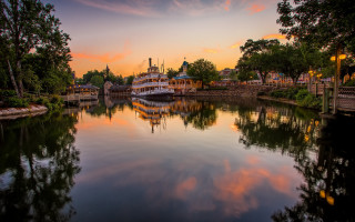 Lake dock boat sunset reflection - a colorful sky free wallpaper