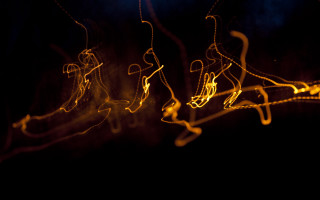 Dancing dark lights abstract electricity - a yellow light free wallpaper