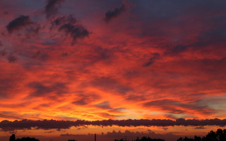 Sunset red sky clouds field - free sunset wallpaper