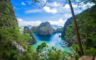 Bay trees rocks boats clouds - free landscape wallpaper
