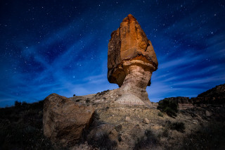 Rock formation field starry sky - space art free wallpaper
