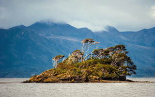 Small island trees lake mountains - a small island free wallpaper