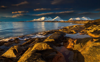 Rocky shore mountains night cloudy - david paton free wallpaper