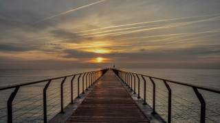 Long pier sunset clouds person - a long pier free wallpaper