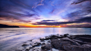 Sunset water rocks sailboat city - ding guanpeng free wallpaper
