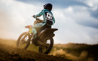 Dirt bike rider sunny sky - dusty free wallpaper