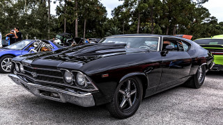 Black muscle car parked people - a black muscle car free wallpaper