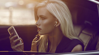 Woman sitting car blonde earbuds - music free wallpaper