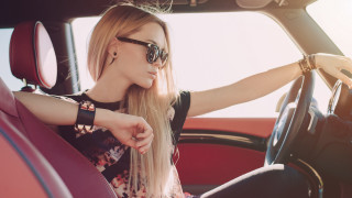 Serious blonde woman car fashion - the steering wheel free wallpaper