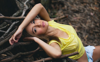 Woman yellow shirt forest portrait - a tree branch in a forest free wallpaper