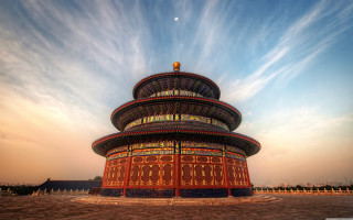 Tall building sky background clouds - a tall building free wallpaper