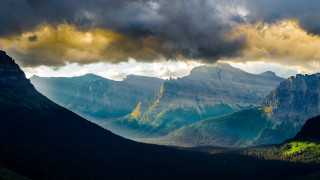 Mountain range cloudy sky valley - dramatic light free wallpaper