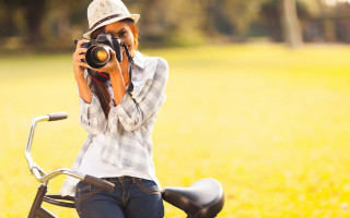 Woman biking self portrait field - a picture of herself free wallpaper