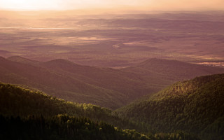 Valley mountains sunset clouds background - a view of a valley free wallpaper