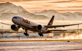 Plane takeoff mountains fog backlit - a plane free wallpaper