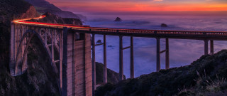 Long bridge sunset ocean mountains - a long bridge free wallpaper