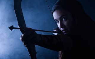 Woman archer smoke blue background - smoke behind her free wallpaper