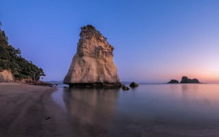 Rock outcrop water beach sunset - widescreen free wallpaper for desktop