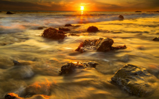 Sunset ocean rocks distant sun - the distance behind free wallpaper