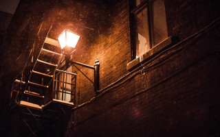 Streetlight brickbuilding stairway window night - a stairway free wallpaper