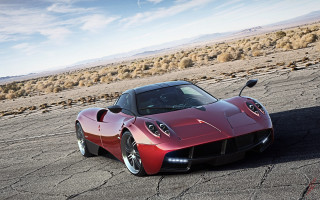 Red sports car desert sky 2 - a parking lot free wallpaper