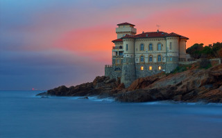 Cliffside mystical building sunset ocean - mystical free wallpaper