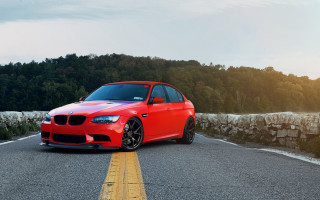 Red car stone wall trees - a red car free wallpaper