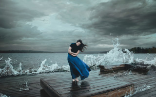 Woman dock stormy waterfront surreal - a dock in front free wallpaper