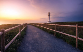 Lighthouse sunset path fence hill - a lighthouse free wallpaper