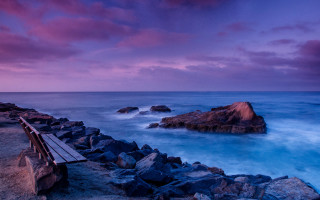 Rocky beach sunset purple sky - a rocky beach next free wallpaper