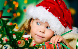 Little girl santa hat christmas - a santa hat free wallpaper