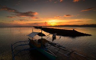 Boat sunset water clouds beach - a boat free wallpaper
