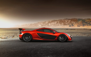 Red sports car desert mountains - a dark sky above free wallpaper
