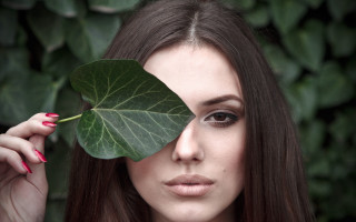 Woman leaf green background nails - a woman holding free wallpaper for desktop