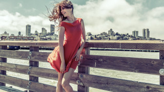 Woman red dress fence water 2 - claire falkenstein free wallpaper