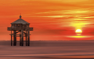 Tower water sunset clouds matte - the sun in the distance free wallpaper