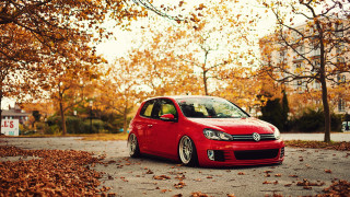 Red car autumn leaves tree - a red car free wallpaper