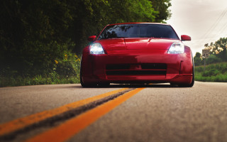 Red sports car road trees 7 - low angle free wallpaper