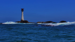 Lighthouse rocky island ocean waves - andrew bell free wallpaper