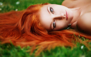Red haired woman lying grass - field free wallpaper