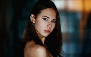 Woman longhair ears serious portrait - her face and shoulder free wallpaper