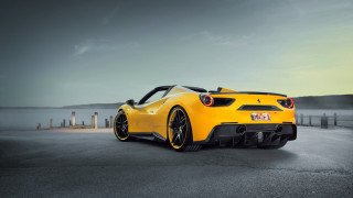 Yellow sports car road water 3 - a cloudy sky in the background free wallpaper