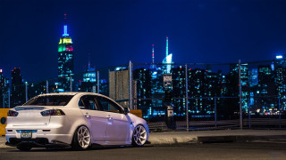 White car night city skyline - a white car free wallpaper for desktop