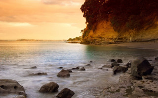 Rocky beach cliff water sunset 2 - a rocky beach free wallpaper