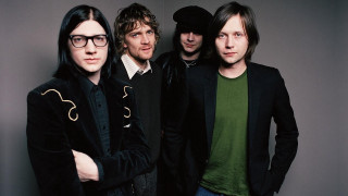 Men group standing wall green - black jacket free wallpaper