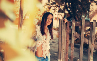 Woman fence autumn portrait blackhair - a wooden fence free wallpaper