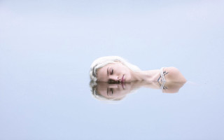 White hair woman floating water - hyperrealistic free wallpaper