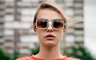 Woman sunglasses sweater building tree - vorticism free wallpaper